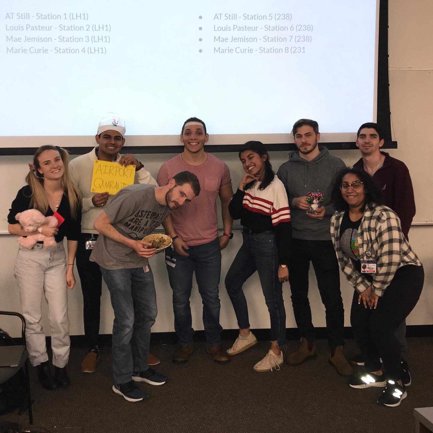 students posing in a lecture room