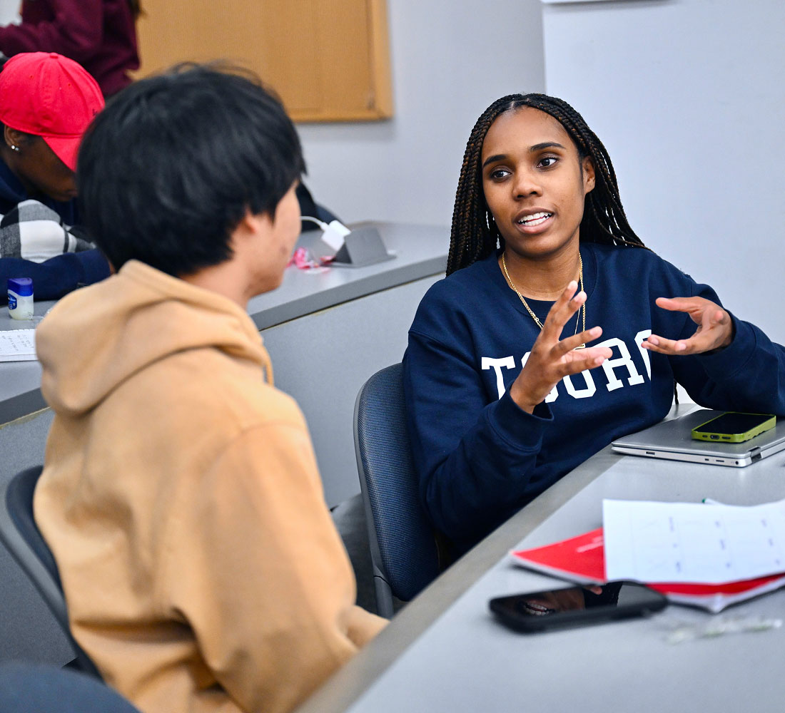 Two students having discussion in class
