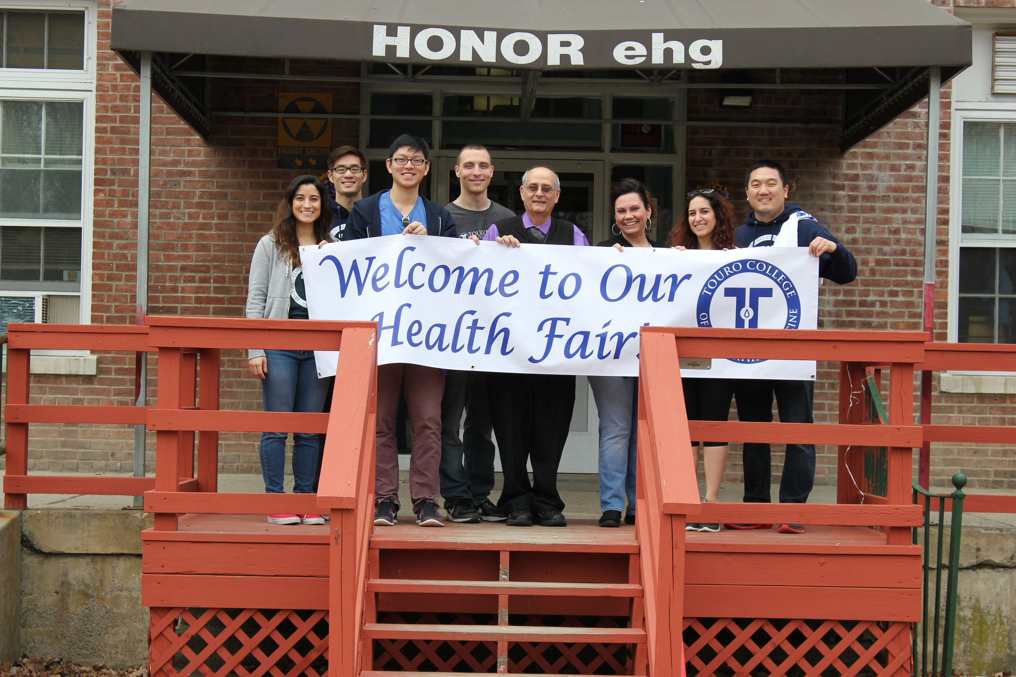 TouroCOM-Middletown students pose in front of the HONORehg building in Middletown, NY, where they held their first community health fair.
