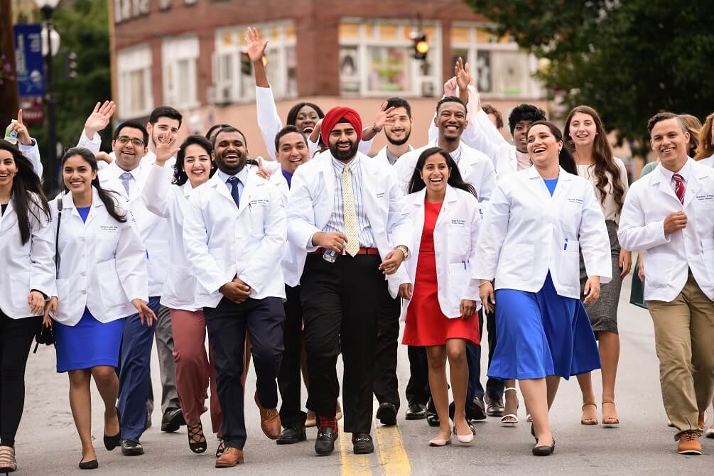 Members of TouroCOM Middletown's Class of 2022 donned their white coat on July 23.