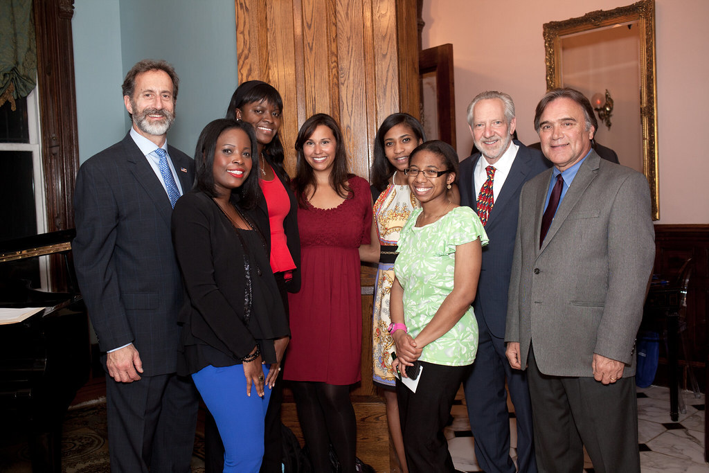 TouroCOM leaders stand together with leaders from Harlem's African-American community.