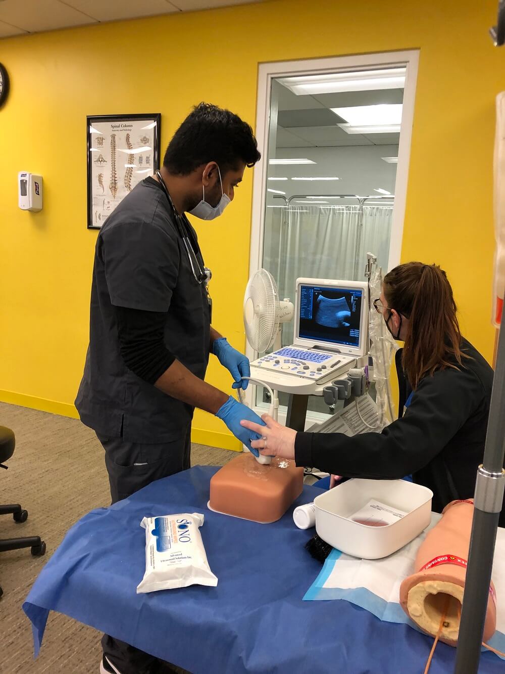 A TouroCOM Middletown student practices performing an ultrasound examination during a medical simulation exercise. 