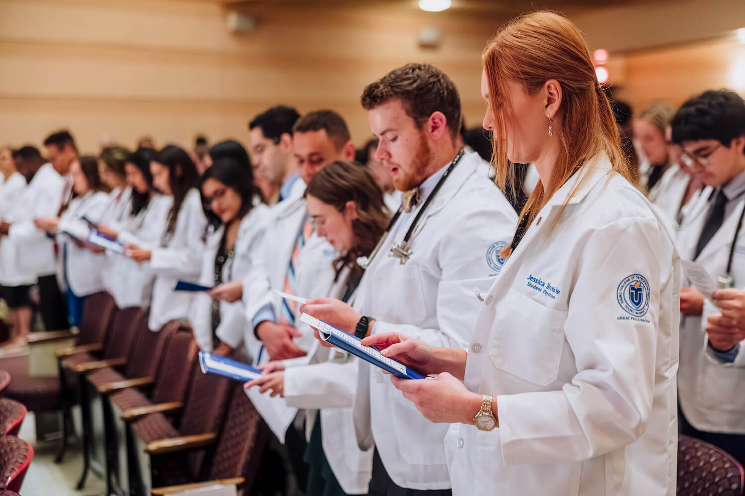 Students at TouroCOM Montana recite the White Coat Oath.