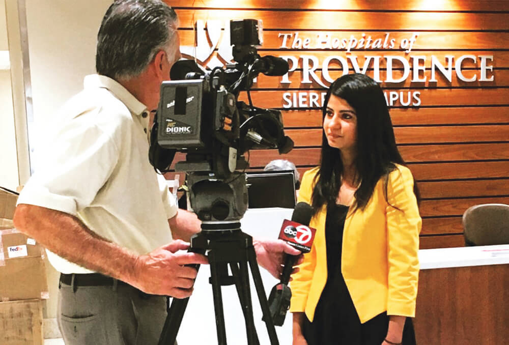 Dr. Sharma at work at the TV station