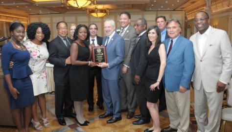 TouroCOM’s Executive Dean Robert Goldberg, DO, surrounded by students, faculty and TouroCOM Community Board Members and partners.