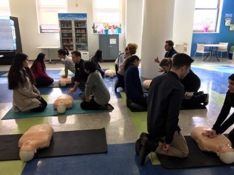 Students teaching Texas Two Step CPR Technique