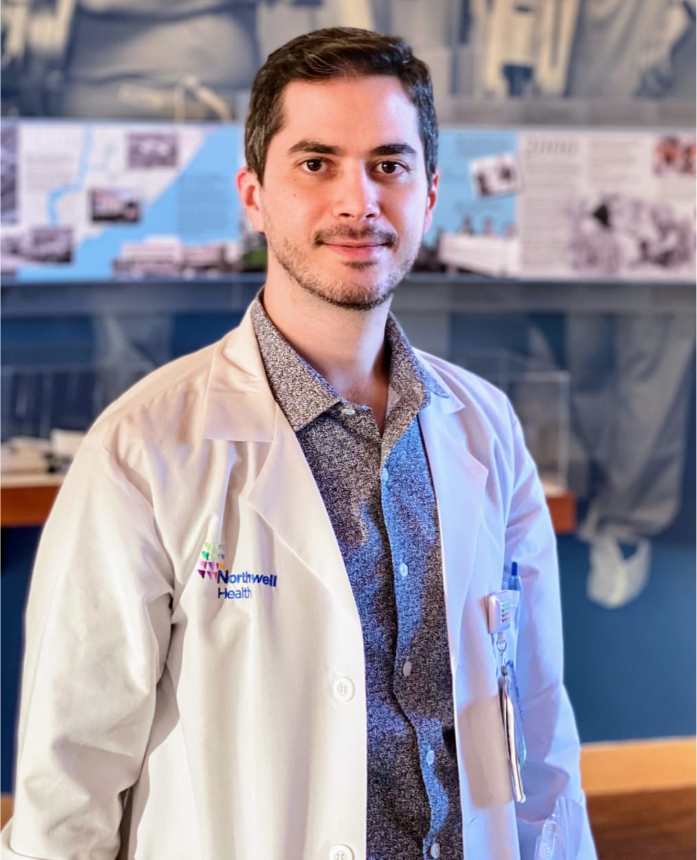 Chaim Poper in northwell health white coat